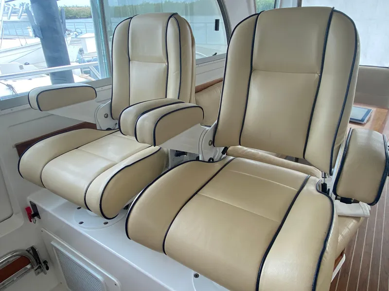 Slide: The Image of Luxurious beige leather seats on a 2014 Back Cove 41 yacht. - 34