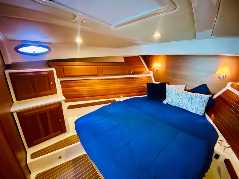 Slide: The Image of Luxurious cabin interior of 2014 Back Cove 41 yacht with blue bedding. - 43
