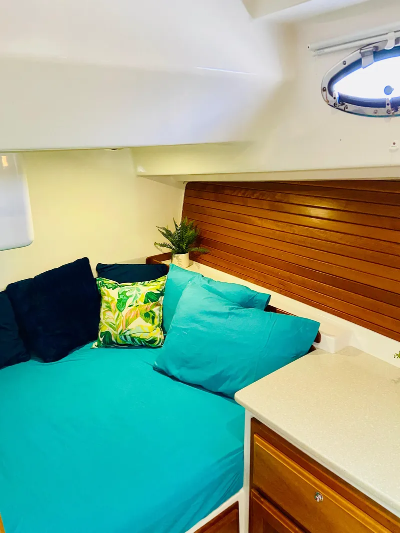 Slide: The Image of Cozy cabin interior of 2014 Back Cove 41 with vibrant cushions and wooden accents. - 46