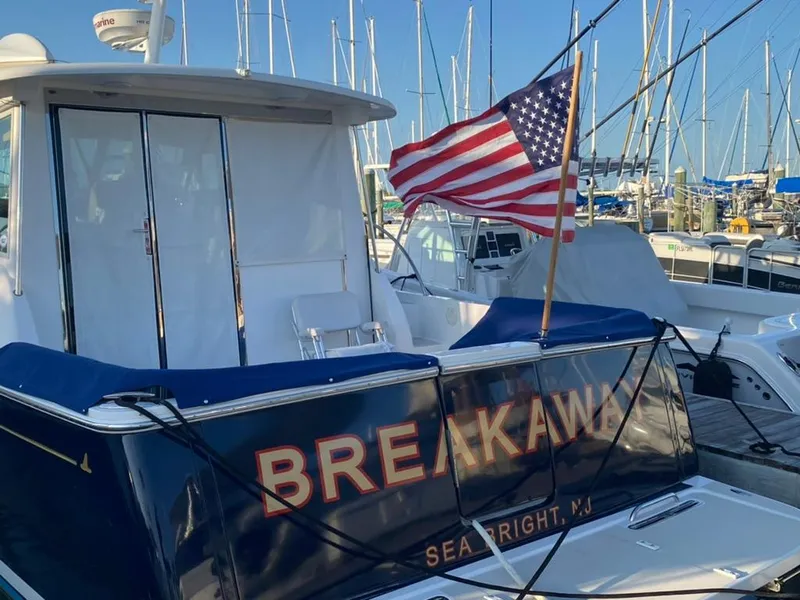 Slide: The Image of Back Cove 41 yacht, 2014 model, docked with American flag, named "Breakaway," Sea Bright, NJ. - 8