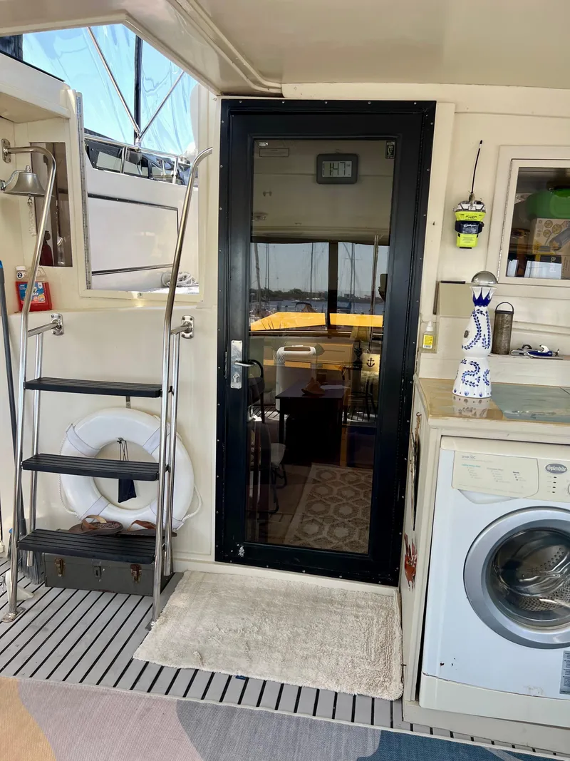 Slide: The Image of Interior of 1989 Californian 48MY yacht with washing machine and glass door. - 26
