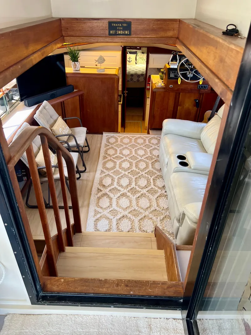 Slide: The Image of Interior of 1989 Californian 48MY yacht with cozy seating and nautical decor. - 27