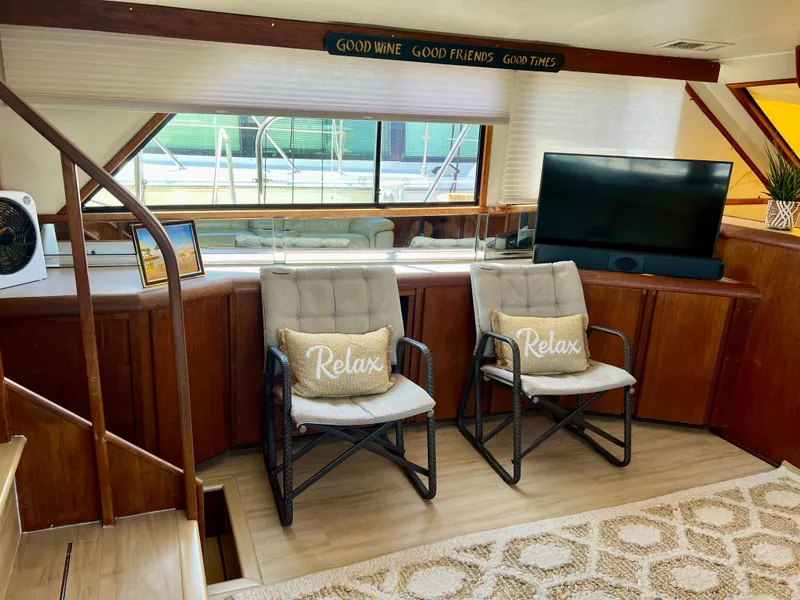 Slide: The Image of Interior of 1989 Californian 48MY yacht with cozy seating and decor. - 28