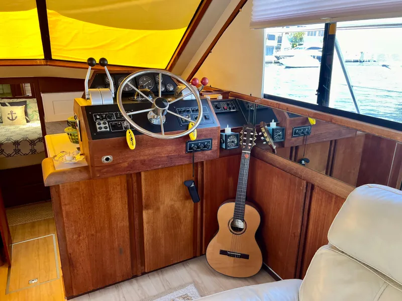 Slide: The Image of Interior of 1989 Californian 48MY yacht with steering wheel and guitar. - 30