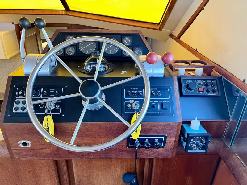 Slide: The Image of Helm of 1989 Californian 48MY yacht with steering wheel and control panel. - 32