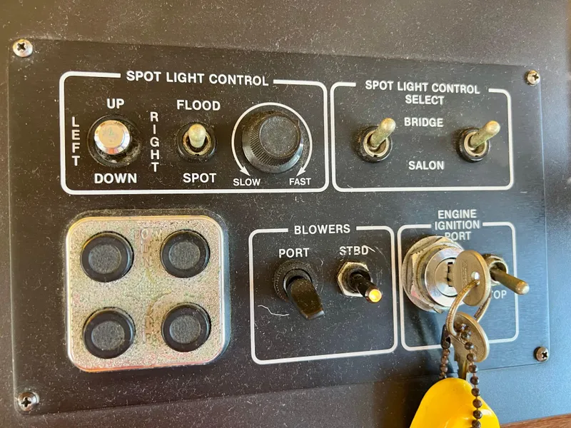 Slide: The Image of Control panel of a 1989 Californian 48MY yacht with spotlight and ignition switches. - 33