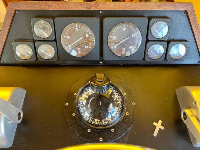 Slide: The Image of Control panel of a 1989 Californian 48MY yacht with gauges and compass. - 34