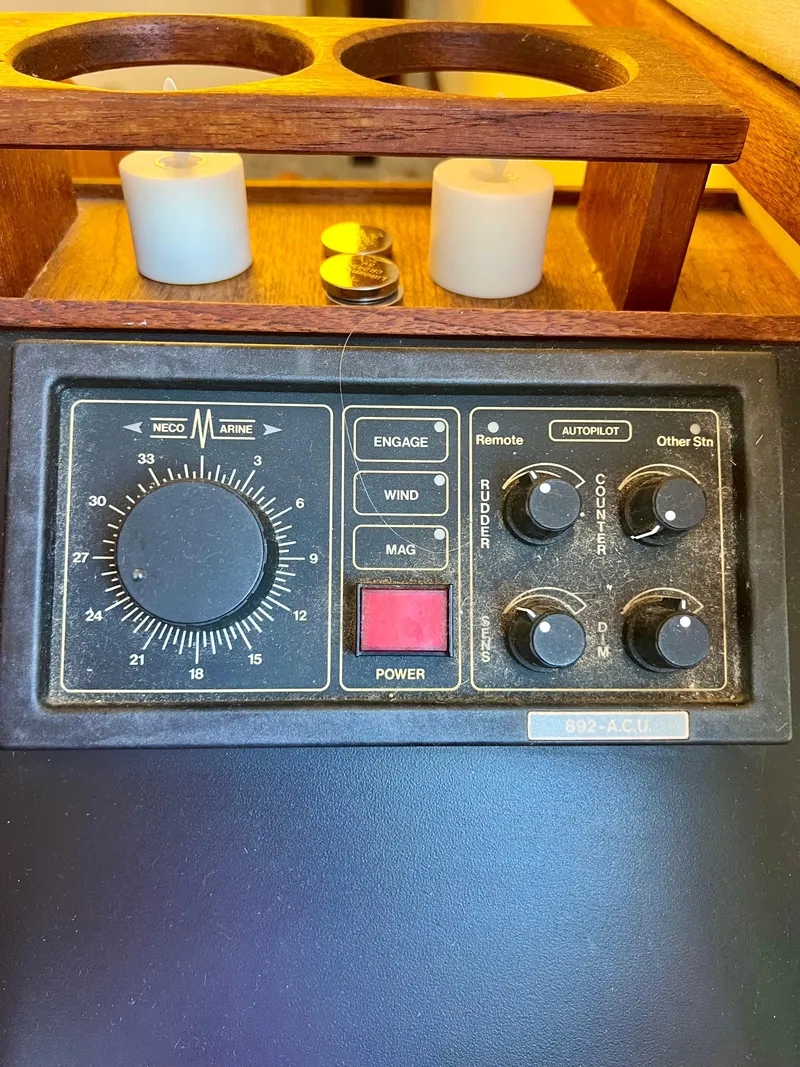 Slide: The Image of Control panel of a 1989 Californian 48MY yacht with candles and coins nearby. - 37
