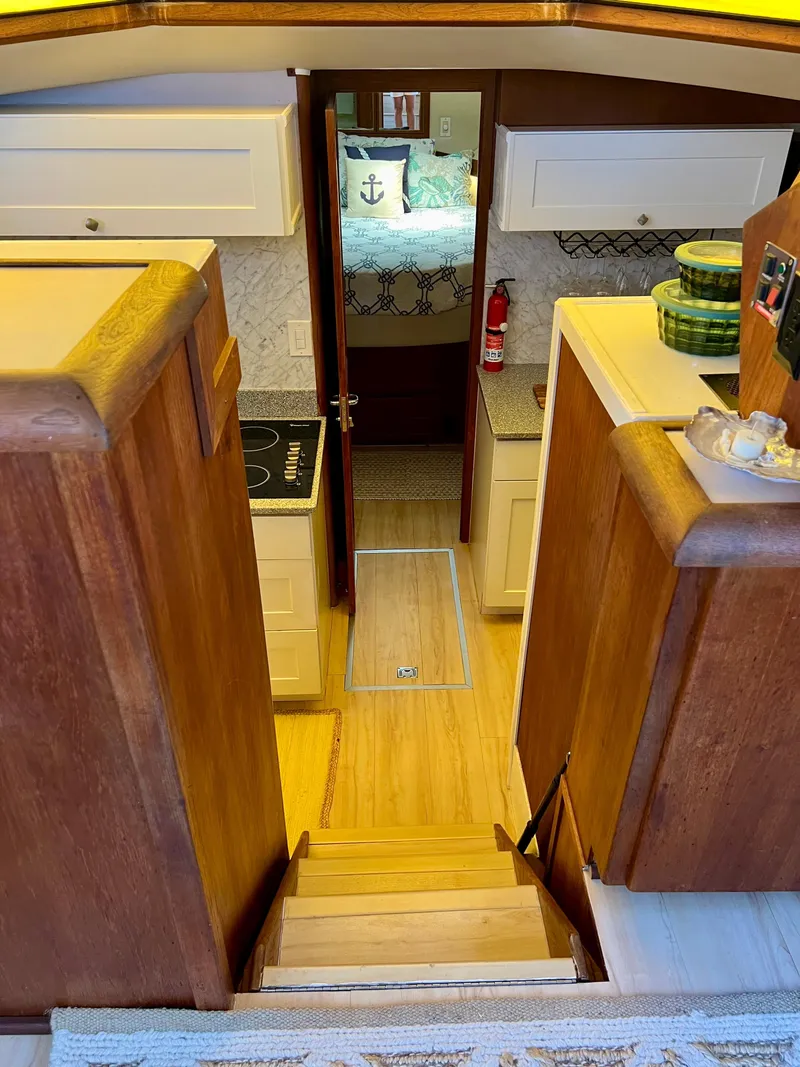 Slide: The Image of Interior of 1989 Californian 48MY yacht with wooden stairs and cozy cabin. - 41