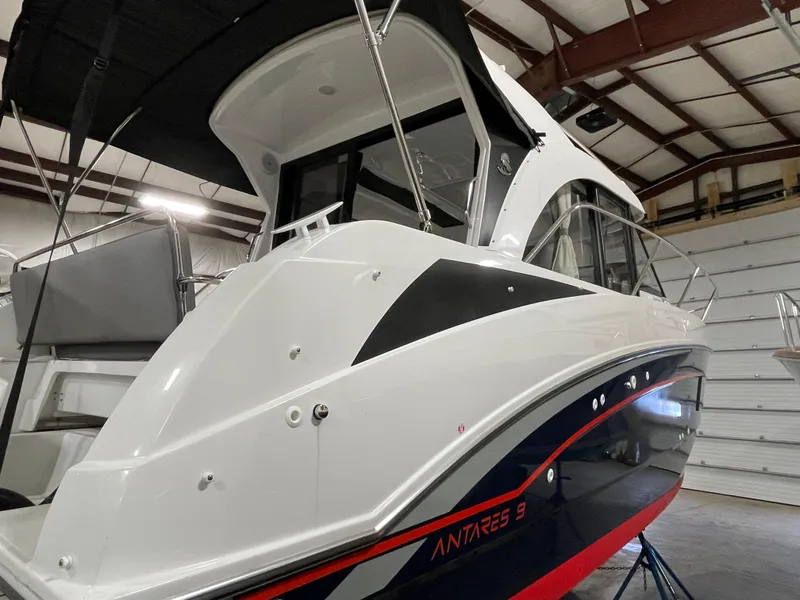 Slide: The Image of 2022 Beneteau Antares 9 boat in indoor storage, showcasing sleek design and modern features. - 10