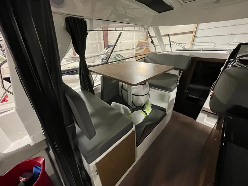 Slide: The Image of Interior of 2022 Beneteau Antares 9 with seating and table arrangement. - 20