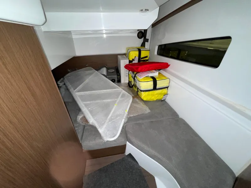 Slide: The Image of Interior cabin of 2022 Beneteau Antares 9 with seating and storage. - 28