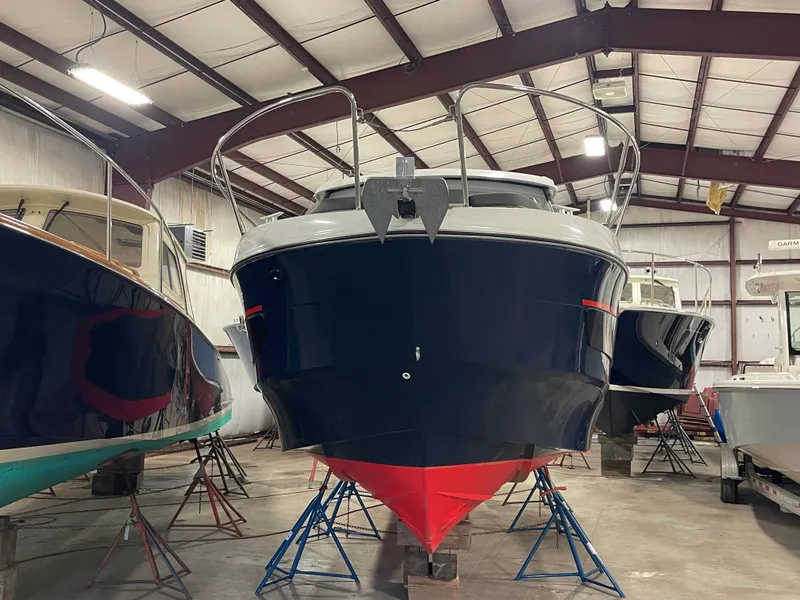 Slide: The Image of 2022 Beneteau Antares 9 boat in storage facility, front view. - 3