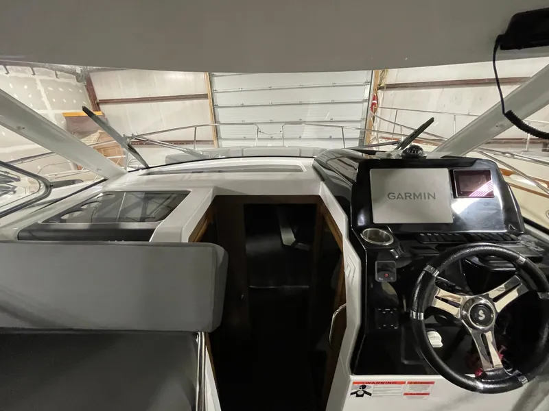 Slide: The Image of Interior view of 2022 Beneteau Antares 9 boat with Garmin navigation system. - 31