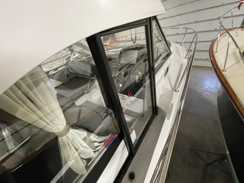Slide: The Image of 2022 Beneteau Antares 9 boat interior view in a showroom setting. - 32