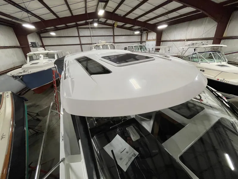 Slide: The Image of 2022 Beneteau Antares 9 boat in indoor storage facility. - 35