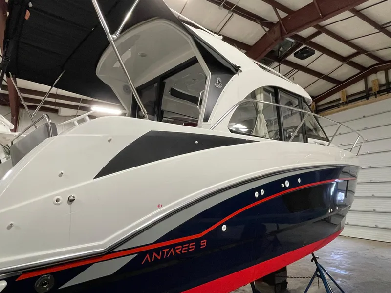 Slide: The Image of 2022 Beneteau Antares 9 boat in a warehouse, side view. - 7