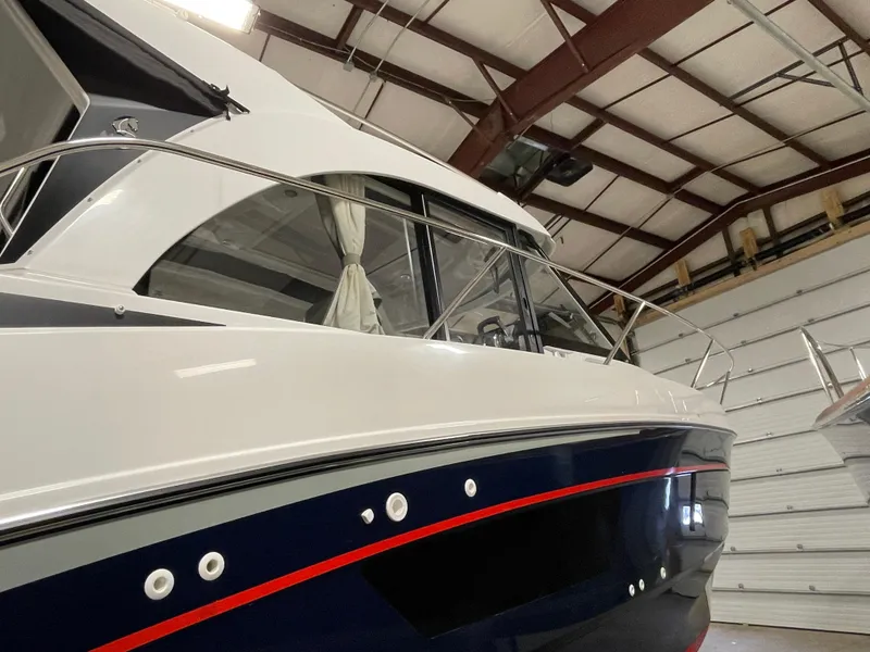 Slide: The Image of 2022 Beneteau Antares 9 boat in indoor storage facility. - 8