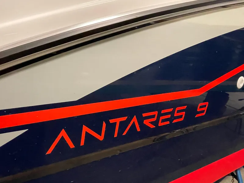 Slide: The Image of 2022 Beneteau Antares 9 boat with sleek design and bold red lettering. - 9