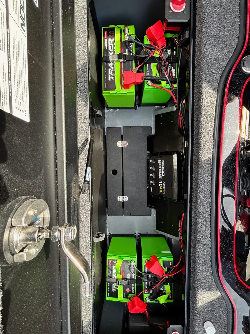 Slide: The Image of 2025 Triton 20XP Patriot battery compartment with Tracker batteries and wiring. - 14