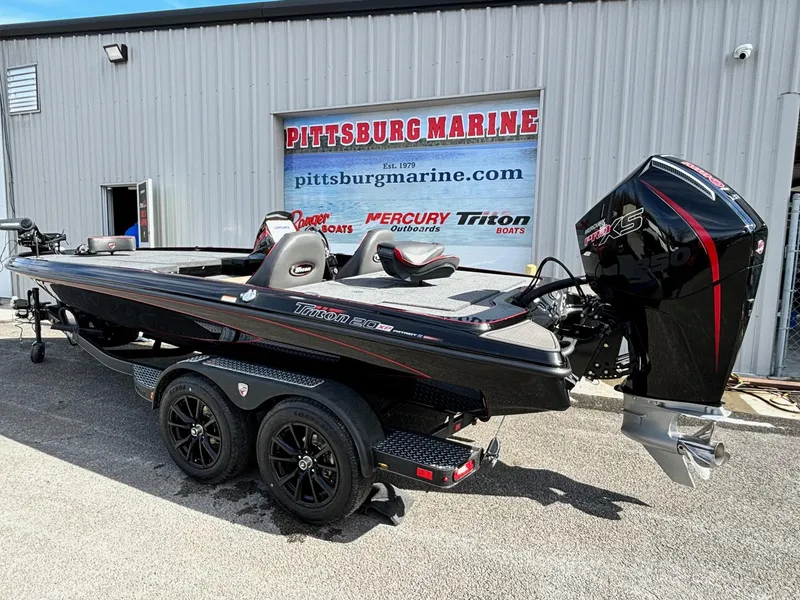 Slide: The Image of 2025 Triton 20XP Patriot boat at Pittsburg Marine dealership. - 15