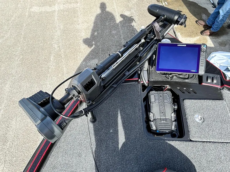 Slide: The Image of 2025 Triton 20XP Patriot boat with advanced navigation system and trolling motor. - 2