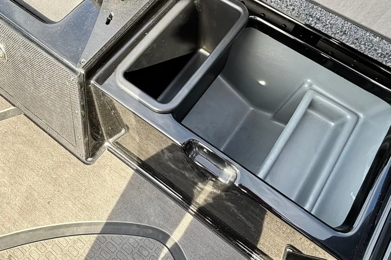 Slide: The Image of 2025 Triton 20XP Patriot boat storage compartment, featuring spacious and organized interior design. - 7