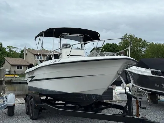 Slide: The Image of 1994 Hydra-Sports 2000 CC boat on trailer, parked outdoors, overcast sky. - 1