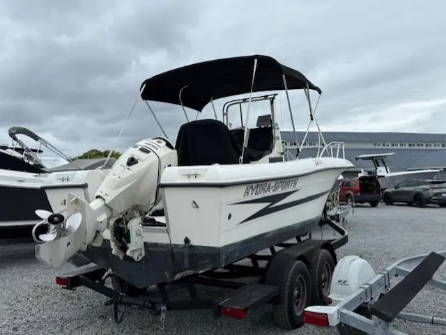Slide: The Image of 1994 Hydra-Sports 2000 CC boat on trailer, parked outdoors under cloudy sky. - 3