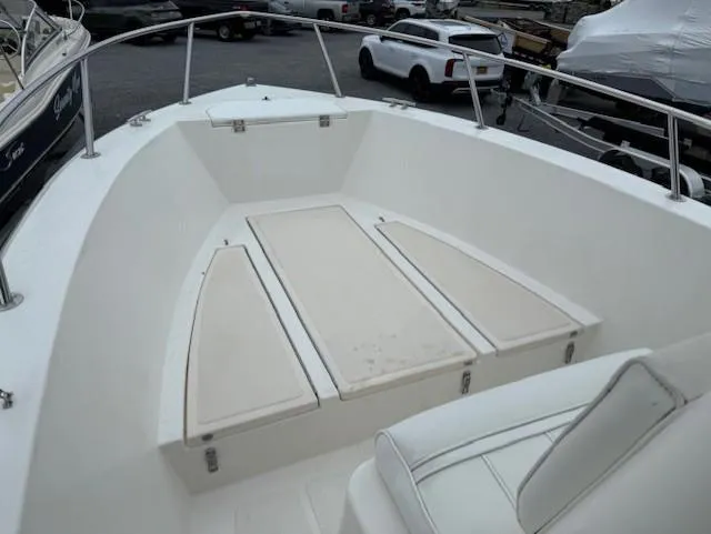 Slide: The Image of 1994 Hydra-Sports 2000 CC boat interior with white seating and storage compartments. - 4