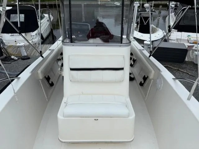 Slide: The Image of 1994 Hydra-Sports 2000 CC boat interior with white seating and console. - 5