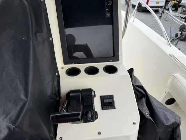 Slide: The Image of 1994 Hydra-Sports 2000 CC boat console with controls and cup holders. - 7