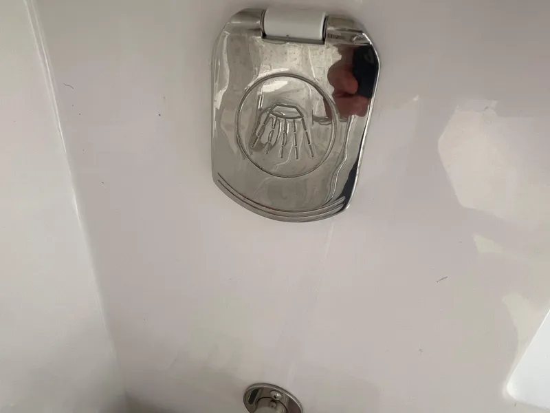 Slide: The Image of Chrome shower cover on 2014 Southport 27 Center Console boat. - 16