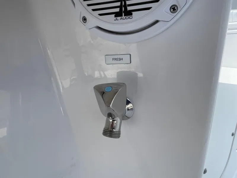 Slide: The Image of Chrome faucet on 2014 Southport 27 Center Console boat with JL Audio speaker. - 24