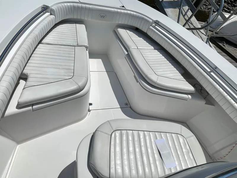Slide: The Image of 2014 Southport 27 Center Console boat with white cushioned seating. - 25