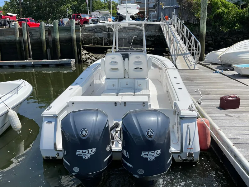 Slide: The Image of 2014 Southport 27 Center Console boat docked with twin Yamaha 250 engines. - 5