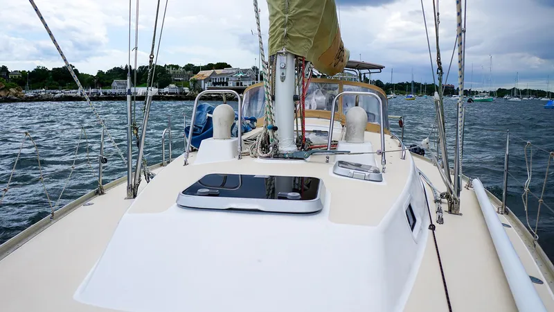 Slide: The Image of 2001 J Boats J/42 sailboat on water, showcasing deck and mast. - 12