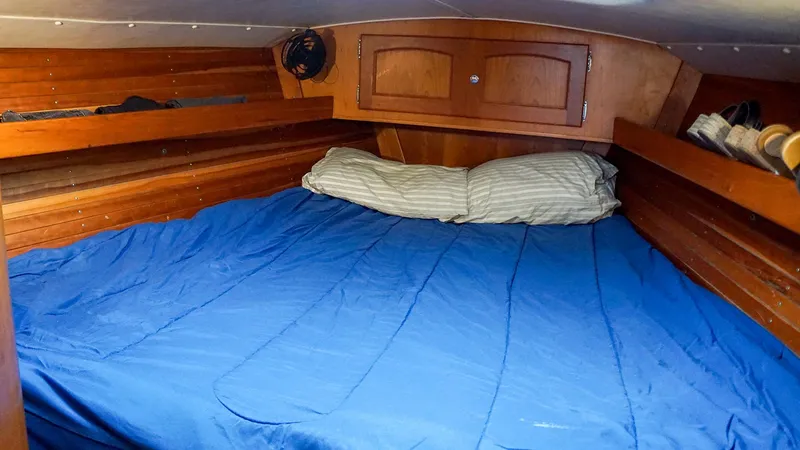Slide: The Image of Cozy cabin interior of 2001 J Boats J/42 sailboat with blue bedding. - 25