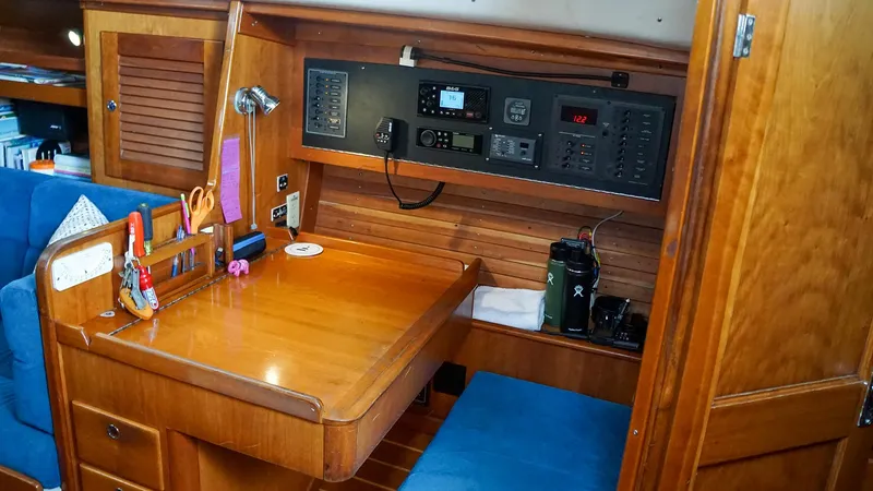 Slide: The Image of 2001 J Boats J/42 yacht interior with navigation station and wooden cabinetry. - 27