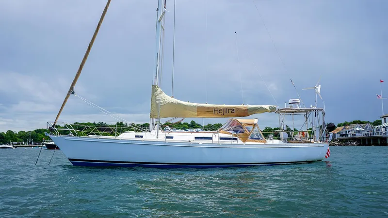 Slide: The Image of 2001 J Boats J/42 sailboat on calm water, side view. - 6