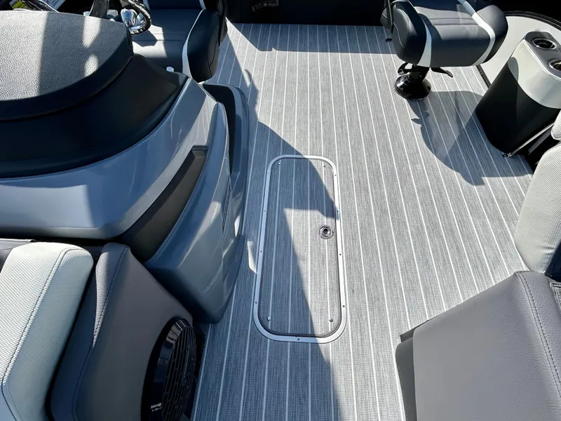 Slide: The Image of 2025 Berkshire 23UL STS 3.0 boat interior with sleek seating and modern flooring. - 11