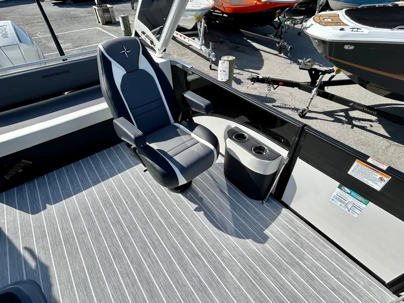 Slide: The Image of 2025 Berkshire 23UL STS 3.0 boat interior with sleek seating and modern design. - 12