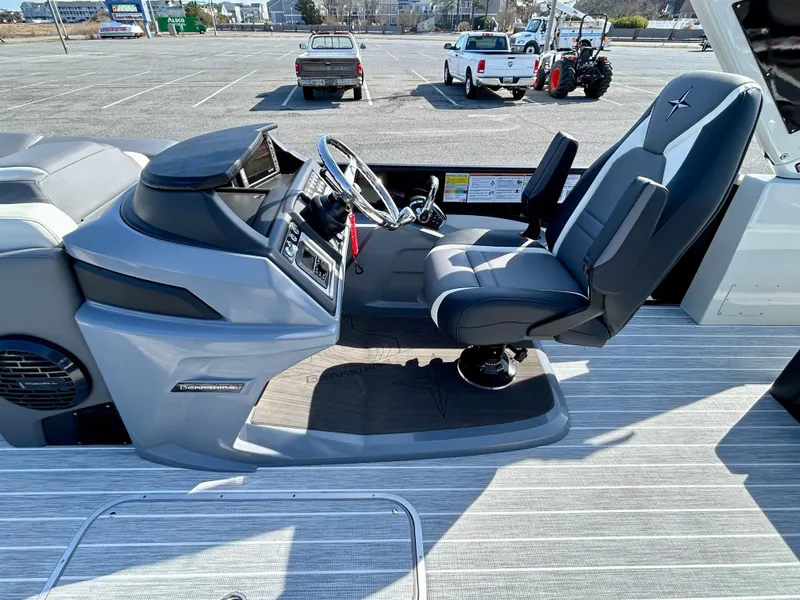 Slide: The Image of 2025 Berkshire 23UL STS 3.0 boat interior with modern helm and captain's chair. - 13