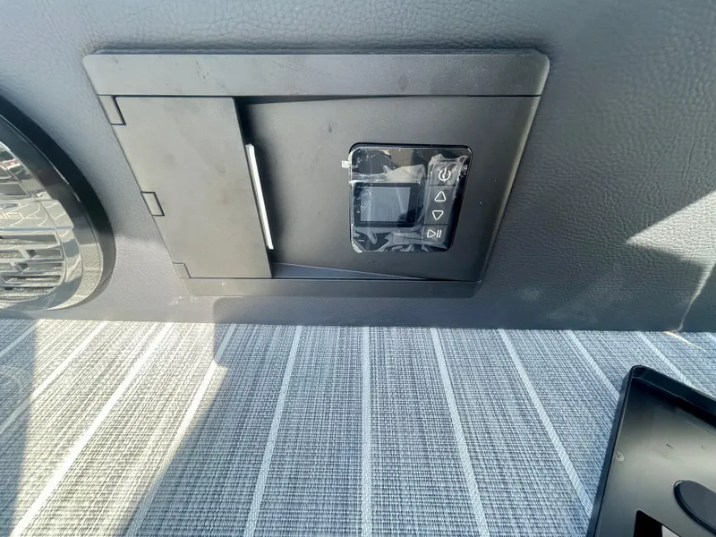 Slide: The Image of Control panel in a 2025 Berkshire 23UL STS 3.0 boat interior. - 20