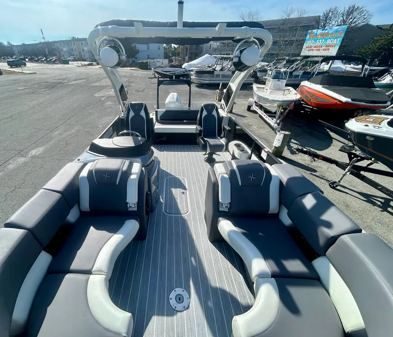 Slide: The Image of 2025 Berkshire 23UL STS 3.0 pontoon boat with spacious seating and modern design. - 5