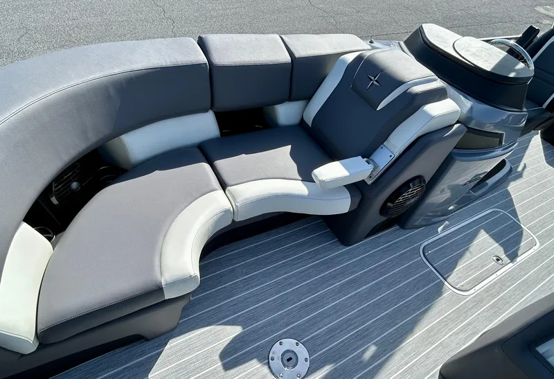 Slide: The Image of 2025 Berkshire 23UL STS 3.0 boat interior with gray and white seating. - 9