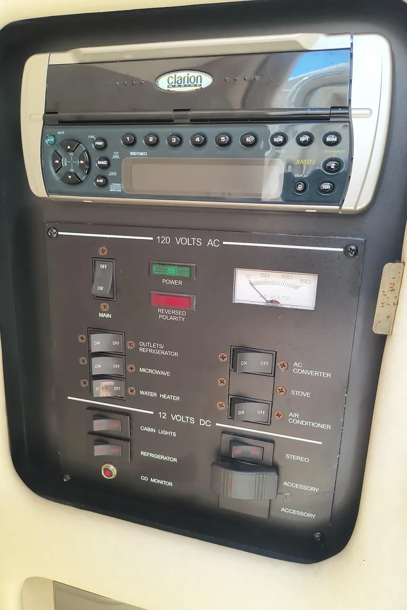 Slide: The Image of Control panel of a 2001 Sea Ray 260 Sundancer boat with Clarion audio system. - 16