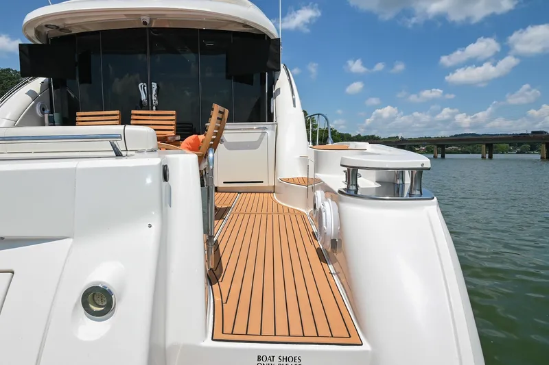 Slide: The Image of 2007 Sea Ray 60 Sundancer yacht with teak deck, docked on a sunny day. - 19