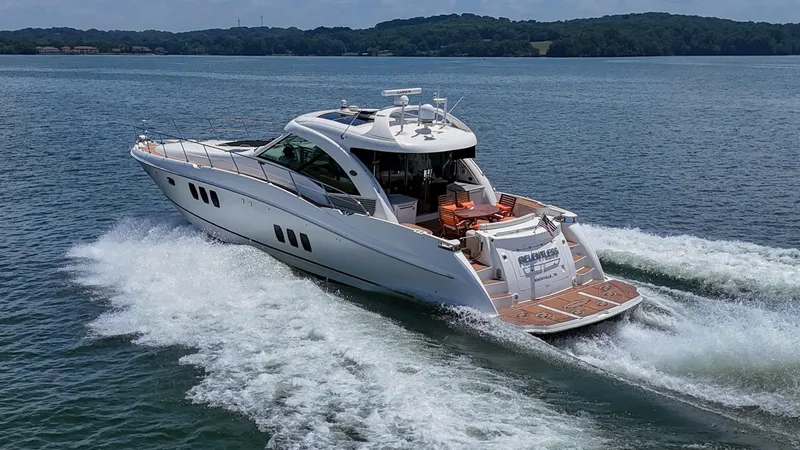 Slide: The Image of 2007 Sea Ray 60 Sundancer yacht cruising on a scenic lake. - 3