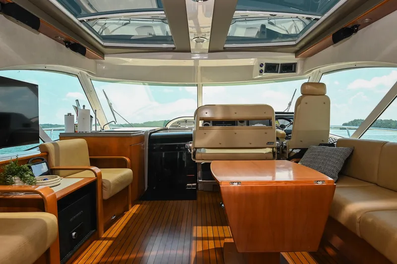 Slide: The Image of Luxurious interior of 2007 Sea Ray 60 Sundancer yacht with elegant seating and wooden finishes. - 37